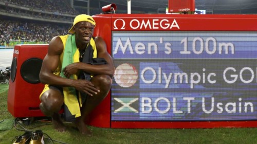 2016 Rio Olympics - Athletics - Final - Men's 100m Final - Olympic Stadium - Rio de Janeiro, Brazil - 14/08/2016. Usain Bolt (JAM) of Jamaica poses next to the electronic result board after winning the gold medal in the race  REUTERS/Kai Pfaffenbach   FOR EDITORIAL USE ONLY. NOT FOR SALE FOR MARKETING OR ADVERTISING CAMPAIGNS.