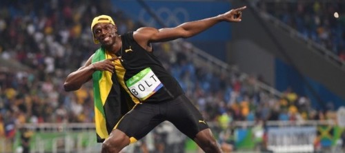 Jamaica's Usain Bolt celebrates after he won the Men's 100m Final during the athletics event at the Rio 2016 Olympic Games at the Olympic Stadium in Rio de Janeiro on August 14, 2016.   / AFP PHOTO / OLIVIER MORIN