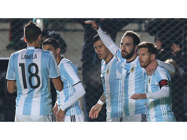 Argentina's Gonzalo Higuain (9) celebrates his goal against Honduras with teammates during a friendly soccer match in San Juan, Argentina, Friday, May 27, 2016. At right is Lionel Messi. (AP Photo/Nicolas Aguilera)