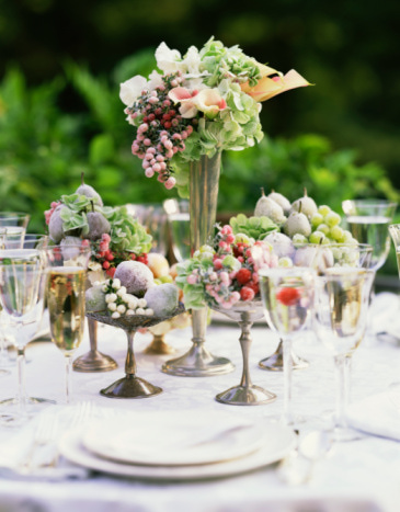 Floral Centerpieces on Table Set for Supper